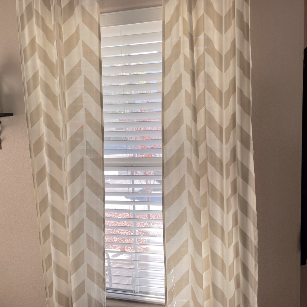 Four sets of Beige and Ivory Chevron pattern curtains.